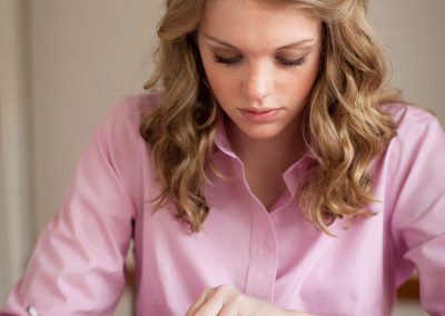 Young woman reading scriptures at the table